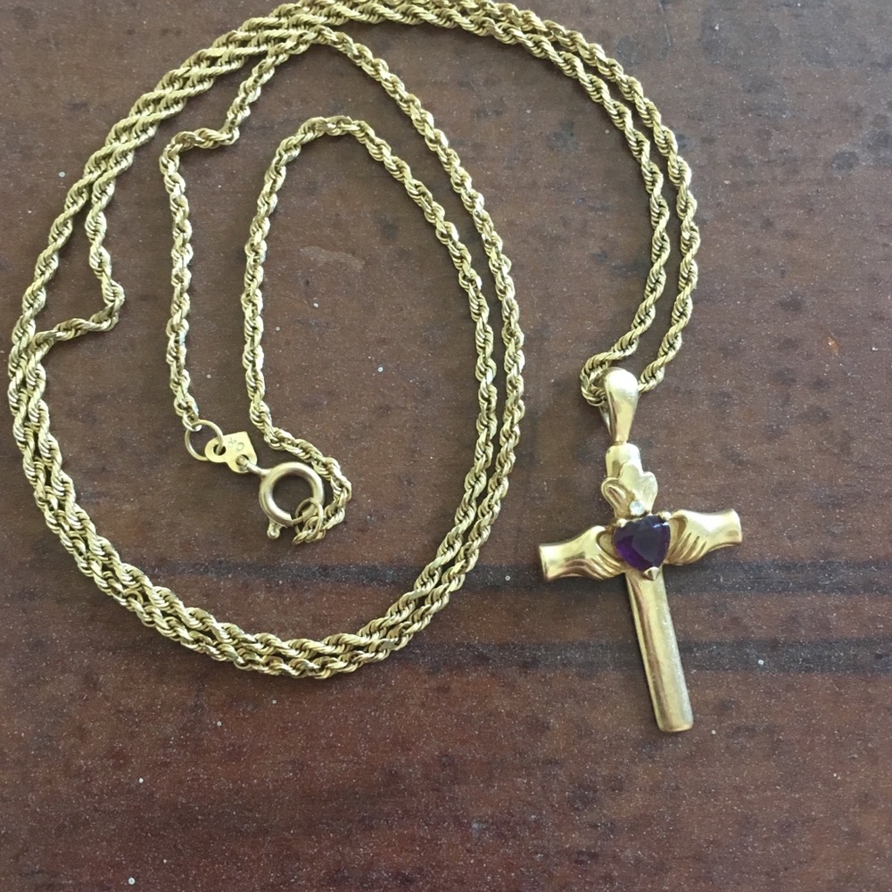 Gold cross with purple stone
